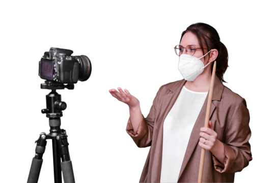 Woman teacher in a medical face mask with a camera on a tripod on a isolated on a white background, copy space