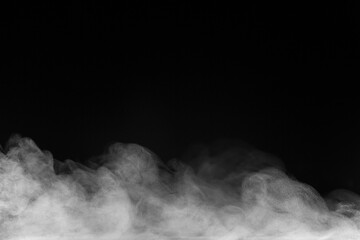Blur white water vapour on isolated black background. Abstract of steam with copy space.  Smoke on black background. Steam flow.