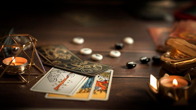 Blurred tarot cards on the table, esoteric concept, fortune telling predictions