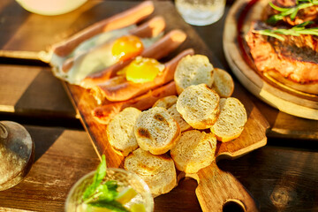 A close-up view of a hearty traditional English breakfast featuring fried eggs and sausages served...