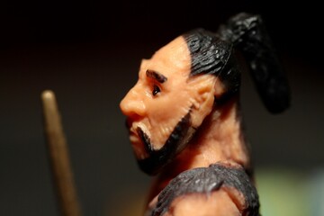 miniature figurine portrait of a primitive caveman