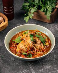 Portion of stewed chicken with vegetables