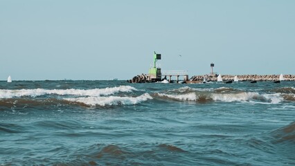 Small Sailing Boats Leaving Port during High Seas for Regatta Race