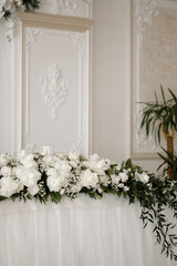 Fototapeta na wymiar Wedding decor. Design. A composition of flowers is on the festive table.