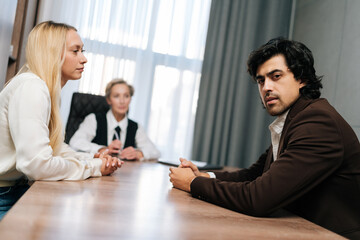 Frustrated woman talking to mature female psychologist during consultation session. Disappointed in...