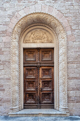 Fototapeta na wymiar An old decorated vintage door in the old town of Kotor, Мontenegro