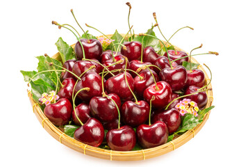 Sweet Red cherry in bamboo basket on white background, Red cherry with leaf isolate on white with clipping path.