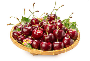 Sweet Red cherry in bamboo basket on white background, Red cherry whih leaf isolate on white with clipping path.