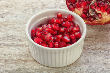Ripe red Pomegranate seeds in the bowl