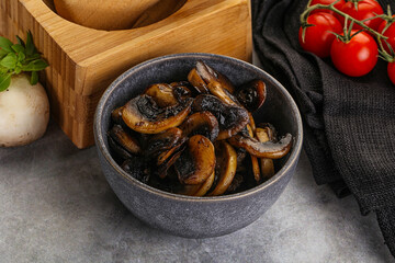 Roasted champignon mushrooms in the bowl