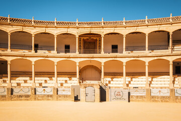 Plaza de Toros (Bullring) in Ronda, Spain. A popular and historic bullring known for its elegant neo-classical architecture featuring a double order of lowered arches.
