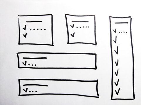 Notepad page with columns marked with a marker, highlighted lines for reading and ticks for list. Business concept, structuring, planning, background