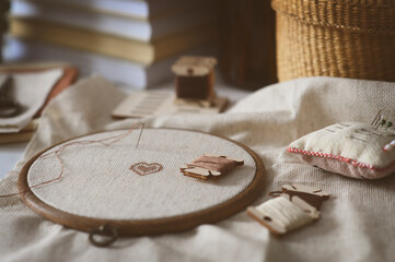 cross stitch embroidery with handcraft accessories. Hobby for winter and autumn cozy evenings at home.