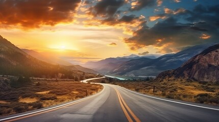 A curvy road winds through the mountains in sunset