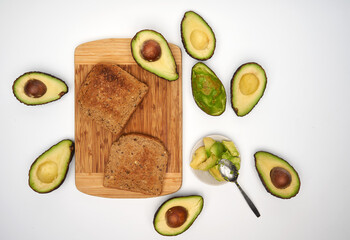 Fresh avocado on toast on white background