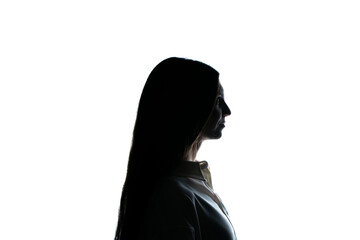 The silhouette of a woman stands enigmatic against a starkly lit white backdrop, her features...