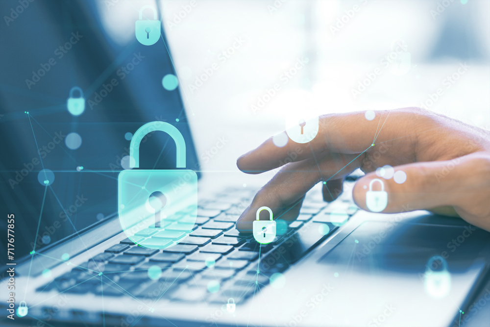 Poster Close up of man hands using laptop keyboard at desk with creative low poly plexus digital padlock interface on blurry background. Safety, security, hacking and protection concept. Double exposure.