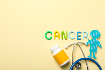 The inscription Cancer in colorful letters with a stethoscope and medicine