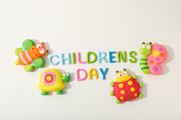 The inscription Children's Day with toy insects