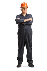 Male factory worker in overall uniform and orange helmet posing with folded arms