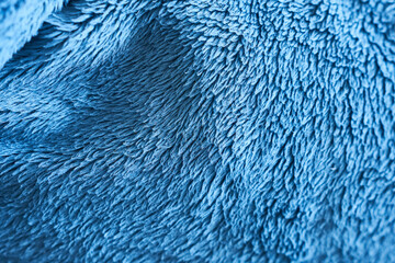 Blue faux fur texture background. Close-up of blue faux fur texture background.