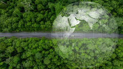 Aerial top view of green electric vehicle car driving over straight forest road, EV car electric vihicle car on forest road with globe green energy and eco power produced from sustainable.