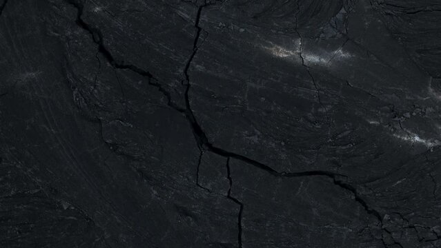 Cracks in the ground in Iceland volcano eruption site, aerial view at night