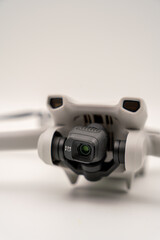 four-winged camera drone in front of a white background to camera isolated