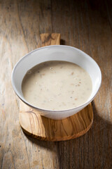 Cream of mushroom soup on a wooden table