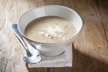 Cream of mushroom soup on a wooden table