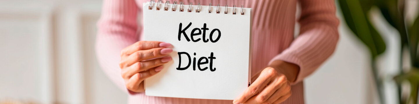 woman hands holding a notepad keto diet. Selective focus.