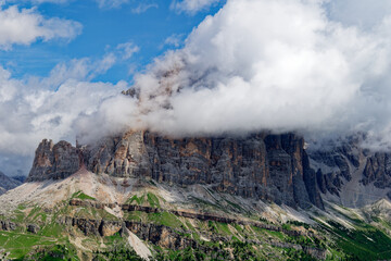 View of Tofane mountain range covered with clouds in the Dolomites, Italy. Amazing destination for trekkers and hikers. Famous mountaineering place.