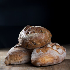 Rustic bread loaf on Black Slate Board.