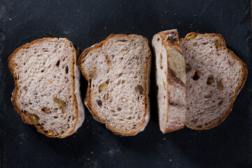 Sliced bread loaf on Black Slate Board.
