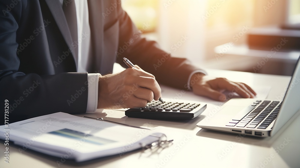 Fototapete generative ai : businessman working on desk office with using a calculator to calculate the numbers