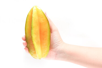 Hand holding fresh organic star fruit delicious isolated on white background clipping path