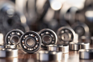Round radial bearings in silver color close up on a blurred background. Bearings in a row for...