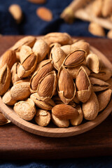 Closeup of almonds，organic badam on table.