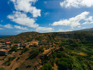 Naklejka premium Barragem Principal in Santiago Island, Cape Verde, water dam view from the top of the mountain, view of the sea, mountains and small village.