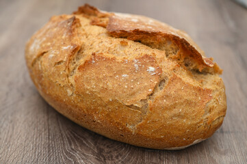 homemade freshly baked bread on a wooden table 10
