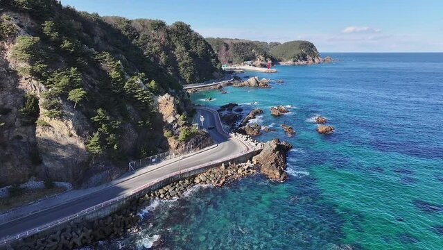 Scenery of a coastal road with a blue sea view
