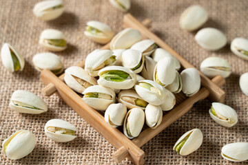 Fototapeta na wymiar roasted salted pistachio nuts on table.