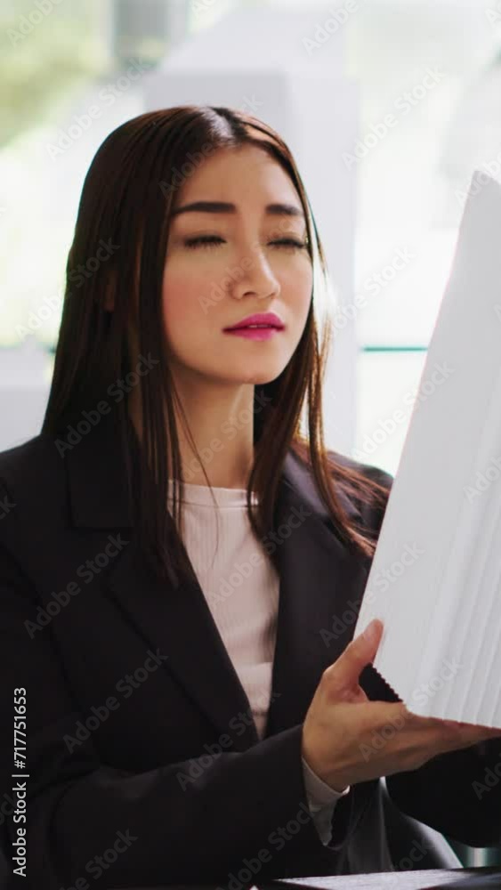 Aufkleber vertical video portrait of designer analyzing 3d architectural model with printed maquette in shared