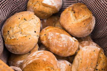 Ruddy rolls of fresh warm grain bread