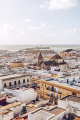 Fototapeta premium Cadiz skyline with a church and fortress of St.Sebastian at the background in Andalusia, Spain.