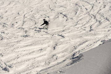 Freeride powder, snowboarding in Les deux alpes resort in winter, mountains in French alps, Rhone Alpes in France Europe