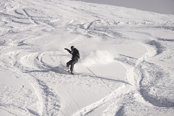 Freeride powder, snowboarding in Les deux alpes resort in winter, mountains in French alps, Rhone Alpes in France Europe © Chawran