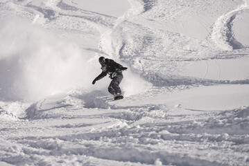 Freeride powder, snowboarding in Les deux alpes resort in winter, mountains in French alps, Rhone...