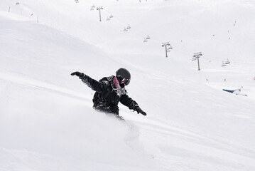 Freeride powder, snowboarding in Les deux alpes resort in winter, mountains in French alps, Rhone...