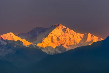 Fotobehang Kangchenjunga Sunrise view of Snow clad Kangchenjunga, also spelled Kanchenjunga, is the third highest mountain in the world.